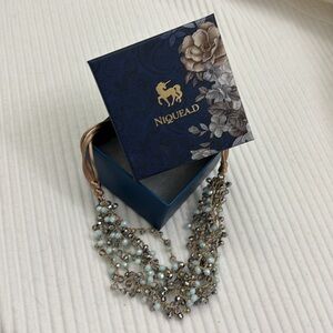Niquea.D multi strand crystal necklace light turquoise and shimmery beads